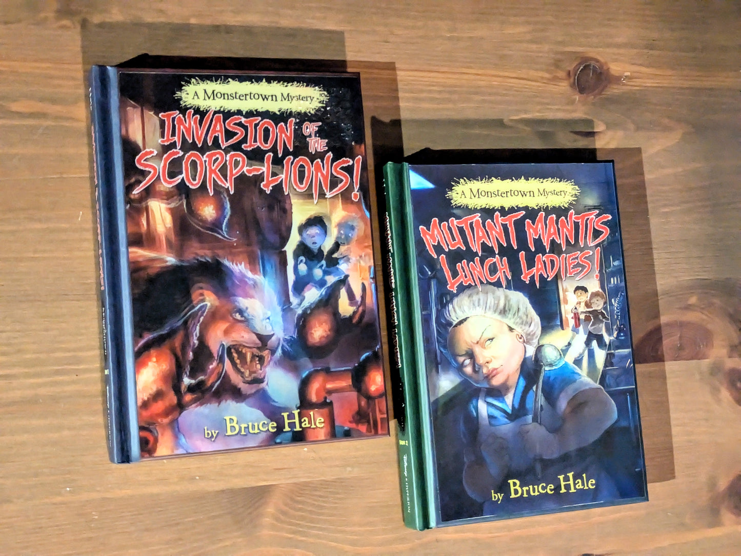 Monstertown Mysteries 2-Pack Set (Invasion of the Scorp-Lions, Mutant Mantis Lunch Ladies) by Bruce Hale - Holographic Hardcovers