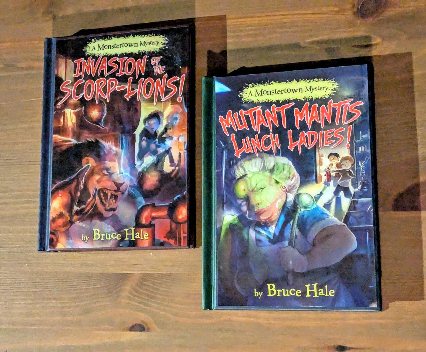 Monstertown Mysteries 2-Pack Set (Invasion of the Scorp-Lions, Mutant Mantis Lunch Ladies) by Bruce Hale - Holographic Hardcovers